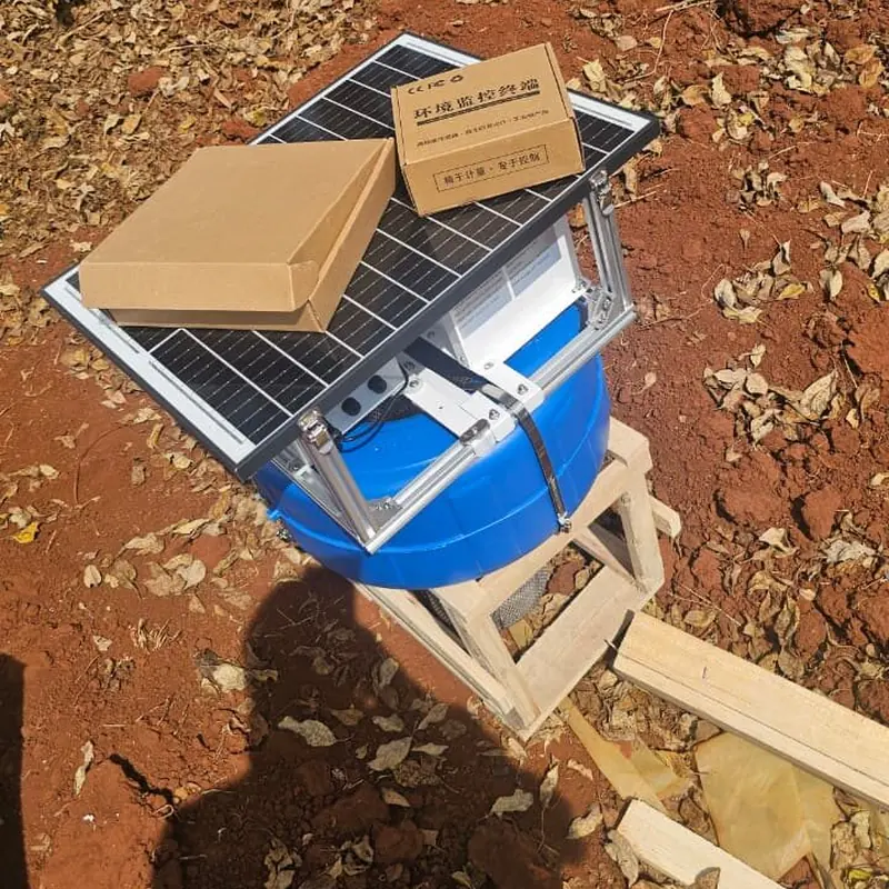 AquaSense solar-powered monitoring unit on a wooden stand during field setup